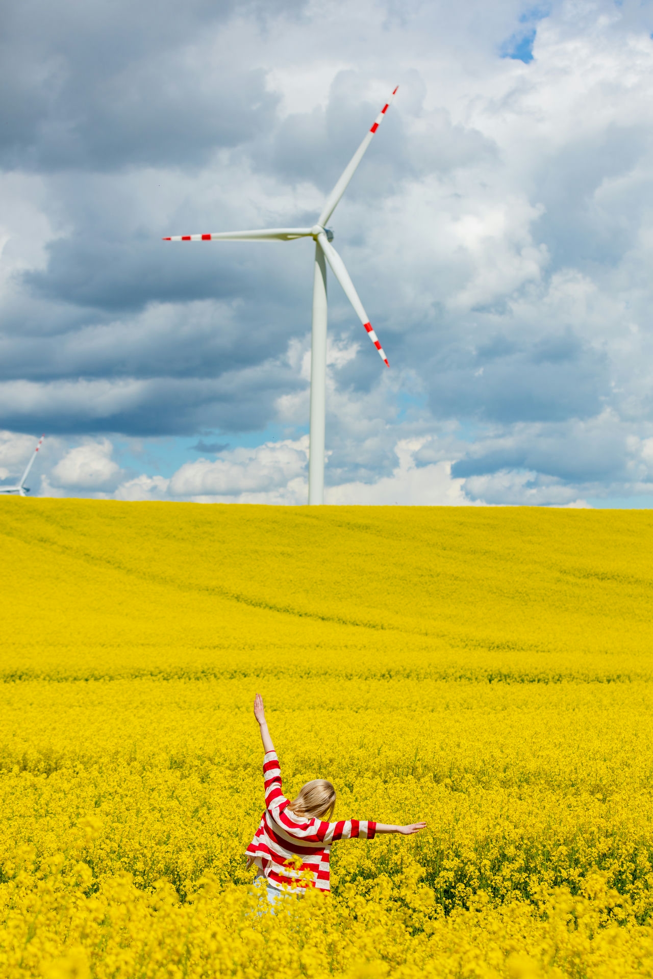 woman-in-red-and-white-striped-jacket-with-wind-tu-2024-09-25-13-10-50-utc